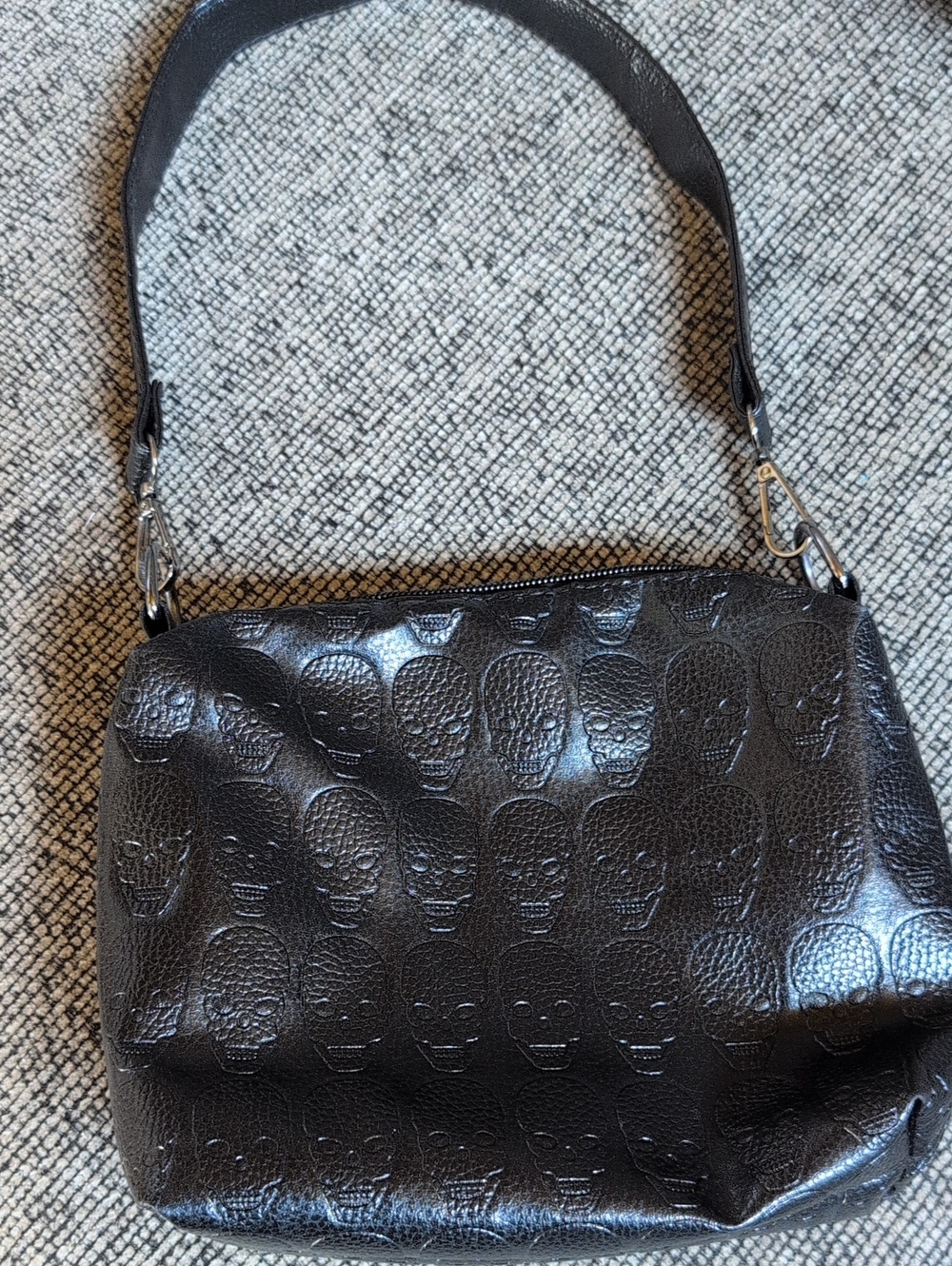 Black embossed skull mini bag/ purse with strap.